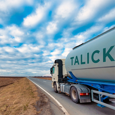 Talick tanker driving through fields