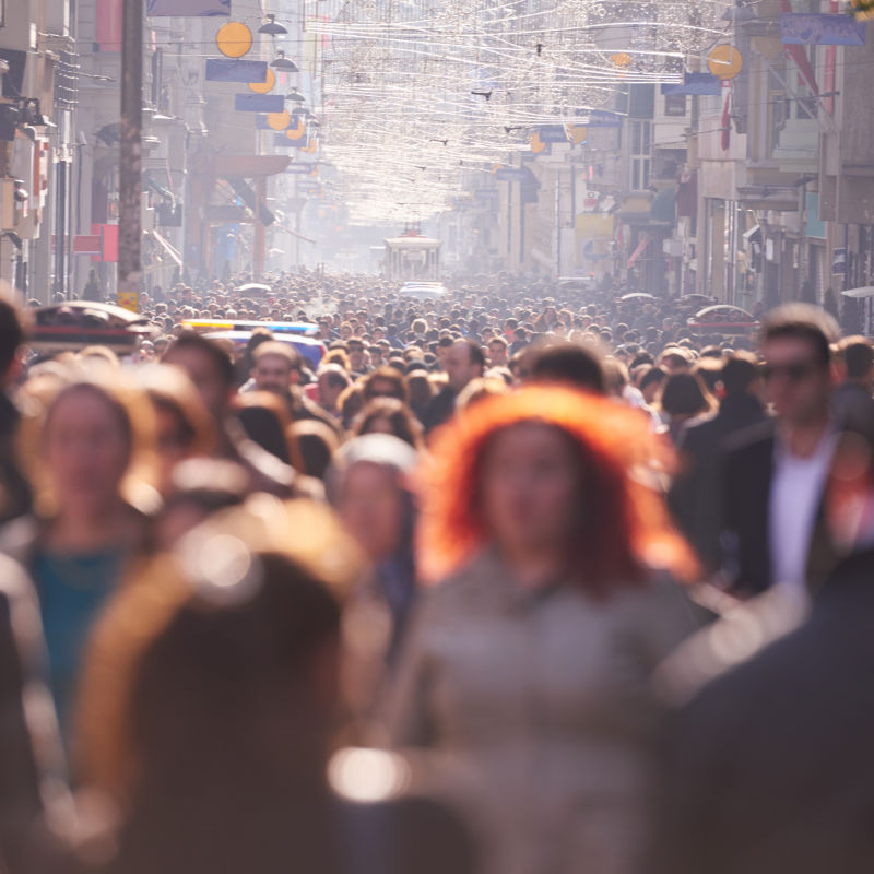 people crowd walking on busy street on daytime